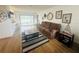 Inviting living room with comfortable seating, view of the backyard, and stylish wood-look floors at 8050 Roxburgh Ct, Weeki Wachee, FL 34613