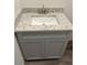 Close-up of bathroom vanity with granite countertop and modern fixtures at 8149 Cashew, Webster, FL 33597