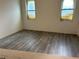 Another view of the unfinished bedroom featuring durable gray vinyl plank flooring at 8149 Cashew, Webster, FL 33597