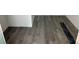 Close up of dark wood-look flooring being installed in a home at 8149 Cashew, Webster, FL 33597