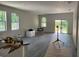 Bright and spacious living room with wood-look flooring and lots of natural light at 8149 Cashew, Webster, FL 33597