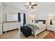 Bright bedroom with a ceiling fan, tile floors, lots of natural light and ample storage space at 8931 Blind Pass Rd # 257, St Pete Beach, FL 33706
