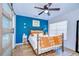 Stylish bedroom featuring a decorative bed frame and a vibrant accent wall at 9304 Lake Chase Island Way, Tampa, FL 33626