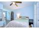 Bedroom with an accent wall, stylish furniture, and ample natural light at 9304 Lake Chase Island Way, Tampa, FL 33626