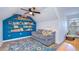 Cozy bonus room with built-in bookshelves and a comfortable seating area at 9304 Lake Chase Island Way, Tampa, FL 33626