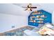 Bonus room featuring built-in bookshelves and seating area at 9304 Lake Chase Island Way, Tampa, FL 33626