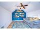 Cozy bonus room with built-in bookshelves and a comfortable seating area at 9304 Lake Chase Island Way, Tampa, FL 33626