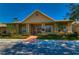 Well-maintained clubhouse with manicured landscaping, welcoming entrance and ample parking at 9304 Lake Chase Island Way, Tampa, FL 33626