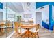 Charming dining room with a wooden table set, mirrored wall, and stylish decor at 9304 Lake Chase Island Way, Tampa, FL 33626