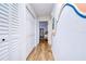 Hallway with a decorative painted wall leading to other rooms at 9304 Lake Chase Island Way, Tampa, FL 33626