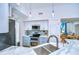 Updated kitchen boasts modern appliances and easy access to the adjacent dining area at 9304 Lake Chase Island Way, Tampa, FL 33626