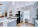 Well-lit kitchen boasts stainless steel appliances, granite countertops, and ample cabinet space at 9304 Lake Chase Island Way, Tampa, FL 33626