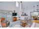 Inviting living room with soaring ceilings, water views, and an open layout to the kitchen at 9304 Lake Chase Island Way, Tampa, FL 33626