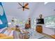 Comfortable living room with vaulted ceilings and a ceiling fan and bright sunny windows at 9304 Lake Chase Island Way, Tampa, FL 33626