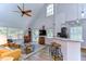 Open living room with vaulted ceilings and views to the kitchen at 9304 Lake Chase Island Way, Tampa, FL 33626