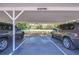 Reserved covered parking spaces with visible signage and well-maintained parking lot at 9304 Lake Chase Island Way, Tampa, FL 33626