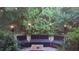 Private backyard oasis with comfortable seating, lush greenery, and inviting tiki torches for evening ambiance at 9628 Charlesberg Dr, Tampa, FL 33635