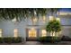 Charming two-story townhouse featuring a well-maintained front yard and a serene, inviting entrance at 9628 Charlesberg Dr, Tampa, FL 33635