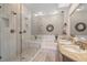 Bright bathroom featuring a shower, a bathtub, double sinks, and recessed lighting at 9727 Tiffany Oaks Ln, Tampa, FL 33612