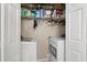 Laundry closet featuring a side-by-side washer and dryer at 9727 Tiffany Oaks Ln, Tampa, FL 33612