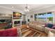 Relaxing living room enhanced by lake views, a fireplace, and abundant natural light at 9727 Tiffany Oaks Ln, Tampa, FL 33612