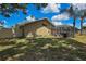 The property offers a screened-in pool area with a well-maintained lawn, ideal for outdoor activities at 9730 Reynosa Dr, New Port Richey, FL 34655