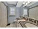 Beautiful bathroom with double sinks, granite countertops, tile flooring and a shower/tub combo at 9730 Reynosa Dr, New Port Richey, FL 34655