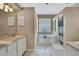 Spacious bathroom with a soaking tub, shower, and stylish fixtures at 9730 Reynosa Dr, New Port Richey, FL 34655