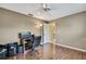 Comfortable bedroom with wood-look flooring, closet and an overhead fan at 9730 Reynosa Dr, New Port Richey, FL 34655
