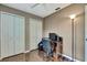 Bright bedroom with wood-look flooring, large closet and an overhead fan at 9730 Reynosa Dr, New Port Richey, FL 34655