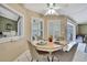 Cozy breakfast nook featuring plantation shutters with an adjacent view of the pool area at 9730 Reynosa Dr, New Port Richey, FL 34655