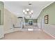 Spacious foyer with white tile floors, and an open view into the living room and front entrance at 9730 Reynosa Dr, New Port Richey, FL 34655