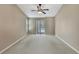This is the main bedroom with direct access to the private pool via sliding glass doors at 9730 Reynosa Dr, New Port Richey, FL 34655
