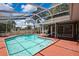 Relaxing screened-in pool features a spacious deck and clear water, perfect for enjoying the outdoors at 9730 Reynosa Dr, New Port Richey, FL 34655