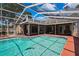 A refreshing screened-in pool invites you with its clear water and expansive deck space for leisure and fun at 9730 Reynosa Dr, New Port Richey, FL 34655