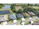 Aerial shot showing homes, a pond, and natural surroundings at 10016 Oxford Chapel Dr, Tampa, FL 33647