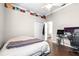 Bedroom featuring hardwood floors, ceiling fan, crown molding, and ample closet space at 10016 Oxford Chapel Dr, Tampa, FL 33647