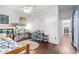 Bright bedroom with hardwood floors and a ceiling fan with a workspace and natural light at 10016 Oxford Chapel Dr, Tampa, FL 33647