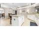 Kitchen and dining room featuring tile floors, an island, and dining set at 10016 Oxford Chapel Dr, Tampa, FL 33647