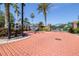 Gated community entrance with brick paved road and lush landscaping at 10016 Oxford Chapel Dr, Tampa, FL 33647