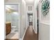 A hallway in the home with access to the bathroom and other rooms in the house at 10016 Oxford Chapel Dr, Tampa, FL 33647