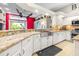 Spacious kitchen with stainless steel appliances, granite countertops, and plenty of counter space at 10016 Oxford Chapel Dr, Tampa, FL 33647