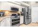 Modern kitchen featuring stainless steel appliances and granite countertops at 10016 Oxford Chapel Dr, Tampa, FL 33647