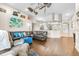 Spacious living room with hardwood floors, ample seating, and an open layout for easy entertaining at 10016 Oxford Chapel Dr, Tampa, FL 33647
