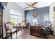 Spacious office featuring hardwood floors, a large window, and ample space for a desk and seating at 10016 Oxford Chapel Dr, Tampa, FL 33647