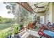 Relaxing screened-in patio with ceiling fan overlooking a well-maintained backyard at 10016 Oxford Chapel Dr, Tampa, FL 33647