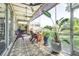Spacious screened-in patio with ceiling fans, offering a relaxing outdoor living space at 10016 Oxford Chapel Dr, Tampa, FL 33647