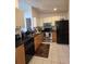 Functional kitchen with stainless steel appliances, laminate countertops, and ample cabinet space at 10918 Freemont Dr, New Port Richey, FL 34654