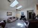 Bright living room with skylights, ceiling fan and comfortable seating at 10918 Freemont Dr, New Port Richey, FL 34654