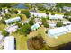Aerial view of community featuring townhomes surrounding a pool and lake at 11622 Declaration Dr, Tampa, FL 33635